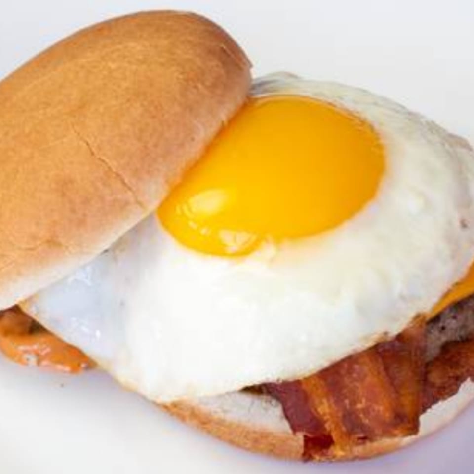 The Texas Ranger burger with a fried egg, bacon, and cheese on a bun.